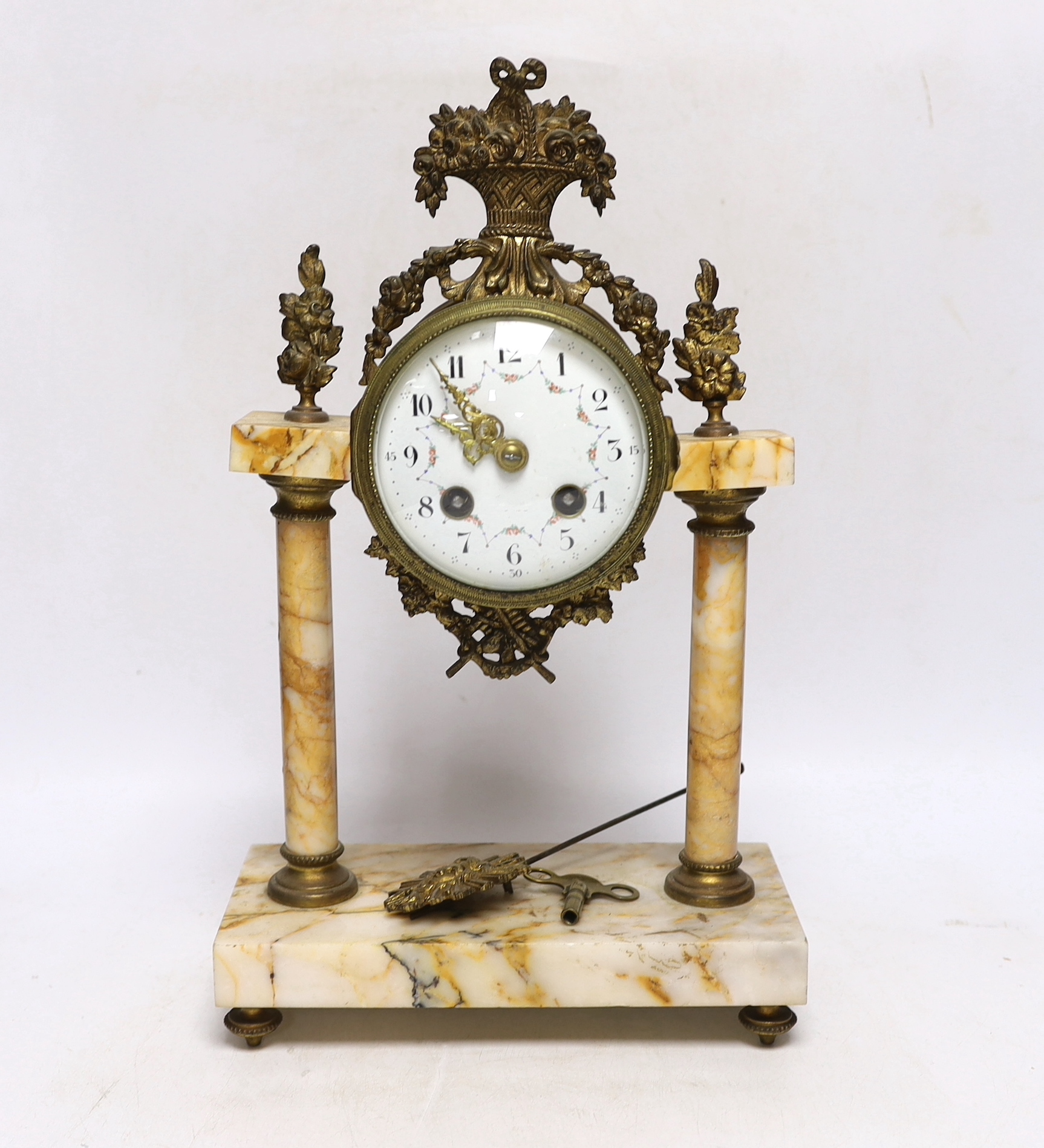 A late 19th century French gilt metal and variegated marble eight day pillar clock, 37cm high